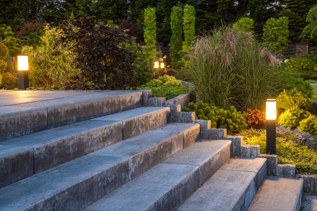 Stone garden steps lit by bollard lights